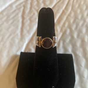 Sterling silver, 14 k gold and a garnet stone